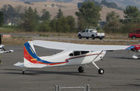 N422RT @ O69 - Colorful Montana-based 1977 Cessna 180K @ Petaluma Municipal airport, CA