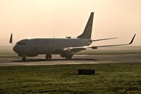 LN-RRL @ EGCC - taxing in fog in the back ground. - by andysantini