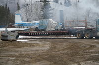 C-FXFZ - The wreckage of C-FXFZ being removed from behind the gas station at Macrae, along the Alaska Highway in Whitehorse, Yukon. - by Murray Lundberg