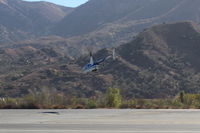 N454WT @ SZP - 2001 Robinson R44 RAVEN, Lycoming O-540-F1B5 derated to 205 Hp continuous, departing climb from SZP Helipad - by Doug Robertson
