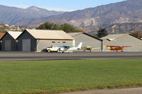N704JH @ SZP - 1976 Cessna 150M, Continental O-200 100 Hp, holding short Rwy 04 behind several  other aircraft - by Doug Robertson