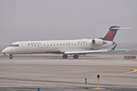 N614SK @ KBOI - Turning onto Echo from RWY 28R as snow begins to fall. - by Gerald Howard