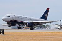 N829AW @ KBOI - Left main touching down.
