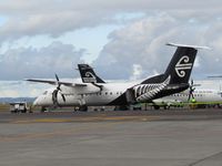 ZK-NET @ NZAA - on dom apron - by magnaman
