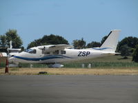 ZK-ZSP @ NZHN - long shot on hazy hot day at hamilton - by magnaman
