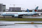 C-FIUF @ YSSY - ROLLING ON A WET 16R - by Bill Mallinson