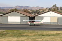 N714HH @ SZP - 1977 Cessna 150M, Continental O-200 100 Hp, taxi to Rwy 04. Note smoky sky to the left from the Thomas Fire now in its 19th day. - by Doug Robertson