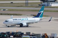 C-GQWJ @ KMCO - Boeing 737-700 - by Mark Pasqualino