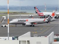 VH-VFY @ NZAA - towing to leave - by magnaman