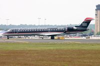 N706PS @ KCLT - US Express CL700 departing - by FerryPNL