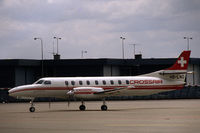 HB-LNO @ EHAM - Crossair Swearingen SA227AC Metro III taxiing at Schiphol airport, the Netherlands, 1983 - by Van Propeller