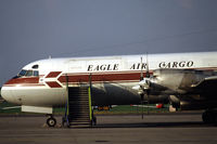 TF-VLN @ EHRD - Eagle Air Cargo Lockheed L-188C(F) Electra freighter on the platform of Rotterdam Zestienhoven airport, the Netherlands, 1983 - by Van Propeller
