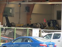 ZS-RZY @ NZAR - in airwork hangar - for sale - behind and to left of ZK-HVN which has the blue tail. Cowling in far corner - by magnaman