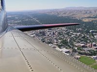 N93012 - Flying over Boise. Photo taken from open radio compartment window. A little windy, but one of the better seats. - by Gerald Howard