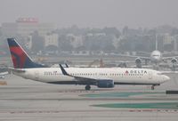 N374DA @ KLAX - Boeing 737-800 - by Mark Pasqualino