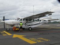 ZK-SDC @ NZAA - could not quite miss the fence!! - by magnaman