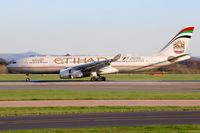 A6-EYM @ EGCC - speedbrakes and reverse thrust applied on rollout on runway 05L - by Jez Poller