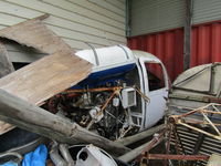 VH-HFZ - With pile of junk in sheds at Caloundra Musuem - by magnaman
