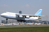 UR-82027 @ LOWW - Departing with the ATC Tower in the backdrop - by Hotshot