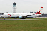 OE-LAE @ LOWW - Departing in front of the ATC TWR. - by Hotshot