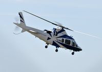 G-TRNG @ EGFH - Visiting A-109E Power departing Runway 04. - by Roger Winser