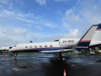 VH-NKD @ NZAA - In sun between showers - by magnaman