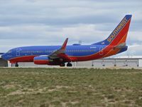 N418WN @ KBOI - Take off run on RWY 28R. - by Gerald Howard