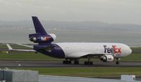 N606FE @ NZAA - off to cargo stand - by magnaman