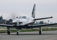 N902TM @ KRHV - Locally-based 2015 Socata TBM 900 taxing to its hangar at Reid Hillview Airport, San Jose, CA. - by Chris Leipelt