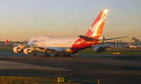 VH-OEF @ YSSY - Evening gold - by Micha Lueck