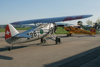HB-RAG @ LSZG - In company of a younger plane. - by sparrow9