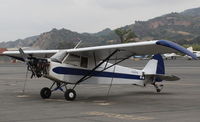N3257B @ SZP - 1954 Piper PA-18-135 SUPER CUB, Lycoming O-320 uncowled upgrade, Highly modified for aerial advertising, Restricted class. See more earlier photos for details. - by Doug Robertson