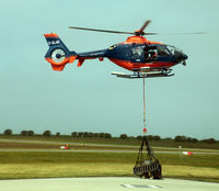 G-GLAB @ EGHC - G-GLAB EC135 lifting from Lands End with underslung load heading for one of the lighthouses. - by Pete Hughes