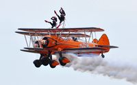 SE-BOG @ EGFH - Aerosuperbatics Kaydet biplane (1) leading N74189 (2) in a formation departure from Runway 22 to display on day 2 of WNAS18. - by Roger Winser