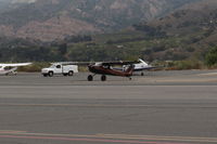 N2946S @ SZP - 1967 Cessna 150G TEXAS TAILDRAGGER Conversion by STC, Continental O-200 100 Hp, taxi across duty runway to Fuel Dock - by Doug Robertson