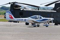 G-BYXM @ EGFH - RAF Tutor T.1 aircraft coded XM about to depart and display on day 1 of WNAS18. RAF display Chinook HC.6A helicoter ZH891 in the background. - by Roger Winser