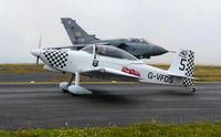 G-VFDS @ EGFH - Raven 5 returning after displaying with 5-ship Team Raven on day 2 of WNAS18. Former RAF Tornado GR.1A aircraft ZA355 in the background. - by Roger Winser