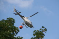G-HITI - In use dropping water over the mountain at the rear of  Cwmcelyn, Gwent - by Chris Smith