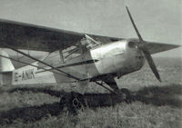 G-ANIK - I forget who owned it but I made my first ever flight in this aircraft - it was a three seater, the third being a small swivel bucket type seat behind the pilot.  The photo is sadly in poor condition but is the best of 3. - by Geoff Cole