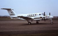 163840 @ EGFH - Visiting US Navy Huron aircraft coded 3840/8G from the Naval Air Facility at RAF Mildenhall. 1994. - by Roger Winser