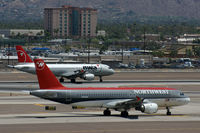 N315US @ KPHX - The penultimate and the final livery for Northwest.  WFU - by Dave Turpie