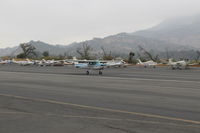 N704JH @ SZP - 1976 Cessna 150M, Continental O-200 100 Hp, landing roll Rwy 22 - by Doug Robertson