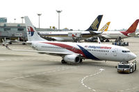 9M-MXM @ WSSS - Pushback for morning departure to KUL as MH604. - by Arjun Sarup