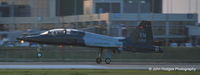 64-13199 @ KAUS - Coming into KAUS at Sunset - by John Hodges