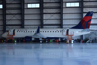 N281SY @ KBOI - In the Skywest Maintenance hangar for final checks. Fresh from the factory in South America. Owned by Skywest Airlines, but flown under Delta colors.
