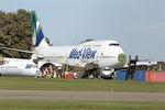 TF-AMV @ EGBP - With Air Salvage International for parting out at Cotswold Airport  Kemble , UK ; under the nose of the B747 is the remains of bizjet L1329 - HB-JGK