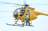 N1578F - Working on a power line near Aransas Pass, TX - by Lynn Lasswell