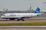 N703JB @ KMCO - Taxiing in after arrival