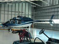 ZK-HBG @ NZHN - in hangar by terminal - handy large glass windows! - by magnaman