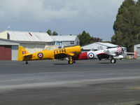 ZK-ENG @ NZAR - and NZ1098 behind - outside warbird hangar - by magnaman